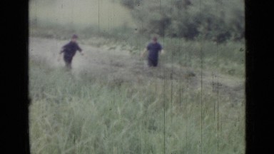 1967: two men wading through marsh and retrieving something. RUSSIA