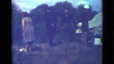 1967: group of people on field, are walking and appears white puppy RUSSIA