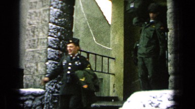 1963: Soldier Saying Goodbye to Physician on Steps Outside While Other Soldiers