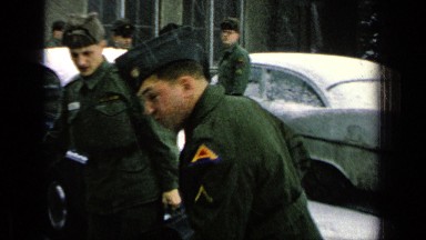 1963: Soldiers Getting Ready to Leave in Snowy Weather, One with Big Smile