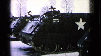 1963: black and white film of parked military tanks. GERMANY