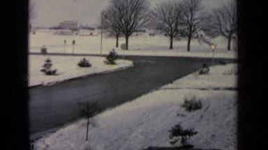 1963: Two Men Walking Quickly on a Snowy Road in Germany