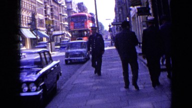 1963: the man was walking in platform, and bus was going LONDON ENGLAND