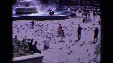1963: people enjoying fresh air in city and walking and talking to each other.