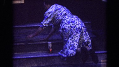1963: person cleaning stairs of house during night time LONDON ENGLAND