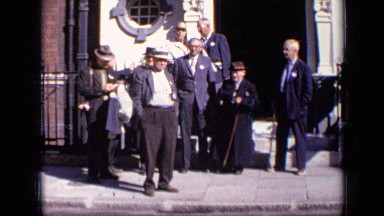1963: group of people are waiting for their chief guest outside