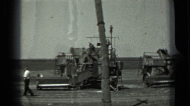 1963: farming machines at farmland and farmers talking together RUSSIA