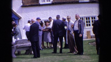1963: the people were standing in front of house ENGLAND
