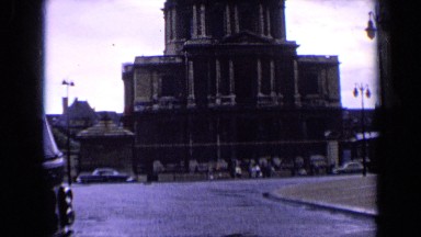 1963: France Very Big Building Alongside Road and Cars Moving