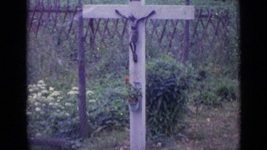 1962: Burial Marker in Swiss Garden with Cross and Flowers