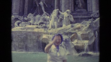 1962: lady standing in front of fountain through magnificent structures VATICAN