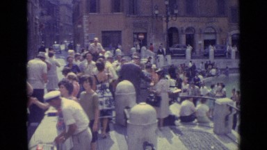 1962: crowd of tourists and locals gather around fountain pool in summertime