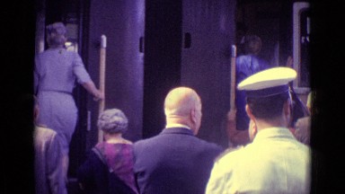 1962: people's getting on train and police standing alongside train VENICE ITALY