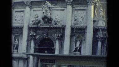 1962: gondola ride past beautifully ornate buildings made of marble while people