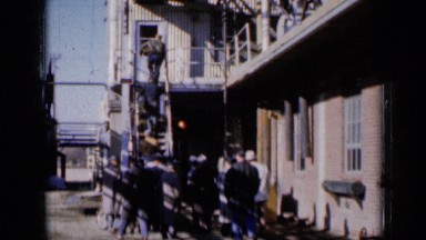 1961: men, most in suits, standing outside of building and north kansas city