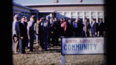 1961: men celebrating outside north kansas city community "y" MISSOURI