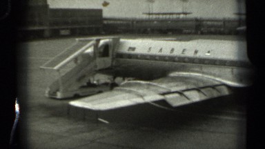 1961: an small aircraft standing for maintenance at airport. MISSOURI