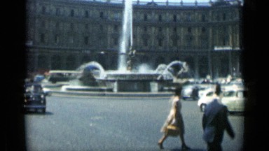 1962: Beautiful Large Water Fountain in Center of Massive City Traffic