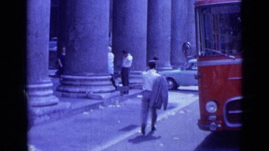 1962: rome ,italy enormous structure of pillars and people are walking in street