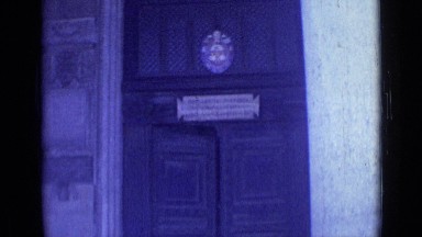 1962: man in green shirt standing in front of large door ROME ITALY