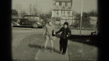 1949: boy and girl walking on road side,they holding their hands NEW YORK