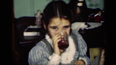 1949: children drinking drinks, and sitting on chair NEW YORK