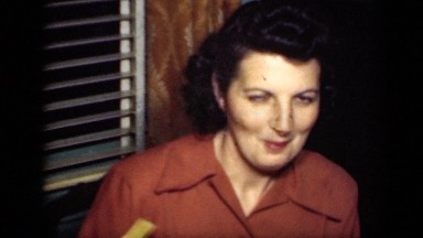 1949: woman and two men conversing in living room NEW YORK