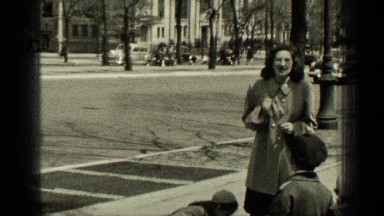 1949: the mother playing with her children near roadside NEW YORK