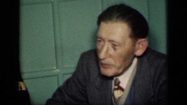 1949: social gathering of two men and two women enjoying conversation and food