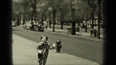 1949: the child was running on platform and putting dust in dustbin box NEW YORK