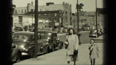 1949: the mother and cute child walking along roadside NEW YORK