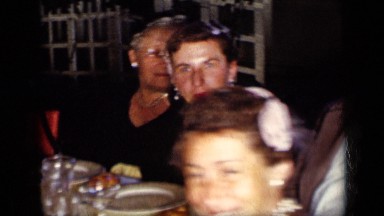 1957: people gathered around table NEW YORK
