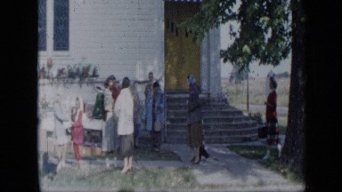 1959: crowd of people milling about at yard sale in someone's front yard ALEDO
