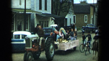 1959: street parade in countryside and cart are coming one by one ALEDO TEXAS