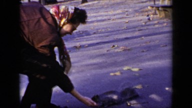 1948: Mom and Son Make Friends with Tame Squirrel in New York