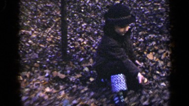 1948: The Child Was Sitting and Giving Food to a Squirrel in New York