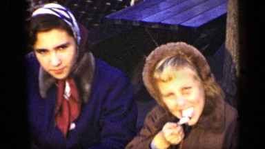 1948: people of family eating ice-cream with joy and girl licking spoon NEW YORK