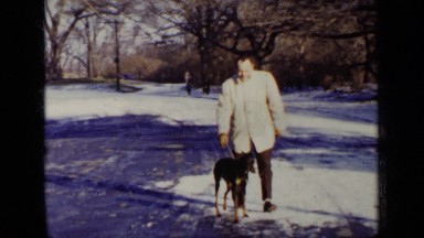 1948: man who happy walking with their dog on roadside NEW YORK