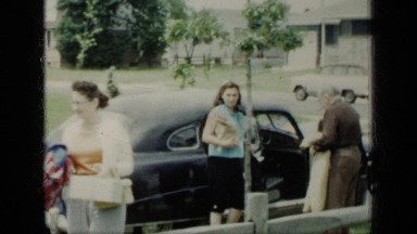 1948: young people exiting vehicle. NEW YORK