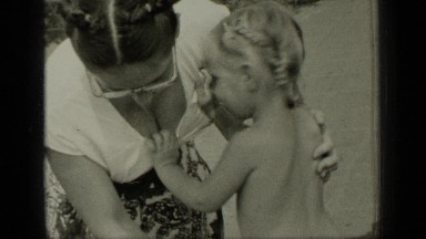 1949: mother wear up dress to her baby, baby ignore wearing dress, baby wear up