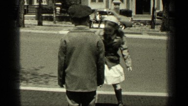 1949: beautiful girl playing with boy near roadside NEW YORK