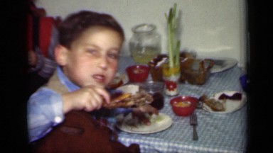 1949: the children were sitting and eating chicken lolly pop NEW YORK