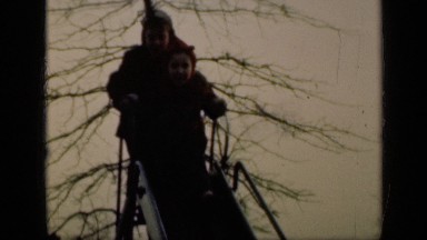 1949: Four Children Playing on Slide During Sunny Day in New York