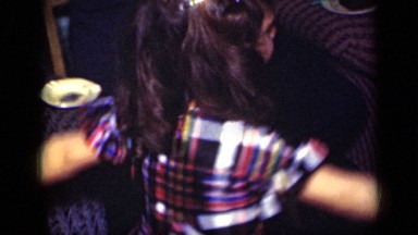 1949: girl flails her arms while her father looks at her endearingly NEW YORK