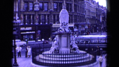 1963: People Standing and Walking on a Street in England