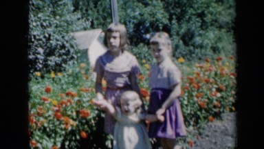 1961: Children Standing Inside Beautiful Flowers in Missouri