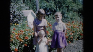 1961: Three Young Girls Posing in Flower Garden, Missouri