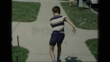1948: Boy Tests Roller Skates on Sidewalk New York
