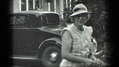 1939: Old Woman Walking to Car with Husband at Long Lake Beach