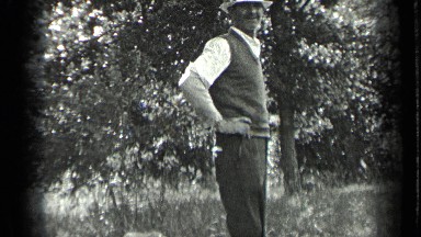 1939: Man with Cocker Spaniel Puppy and Children Playing Outside in Long Lake Canada